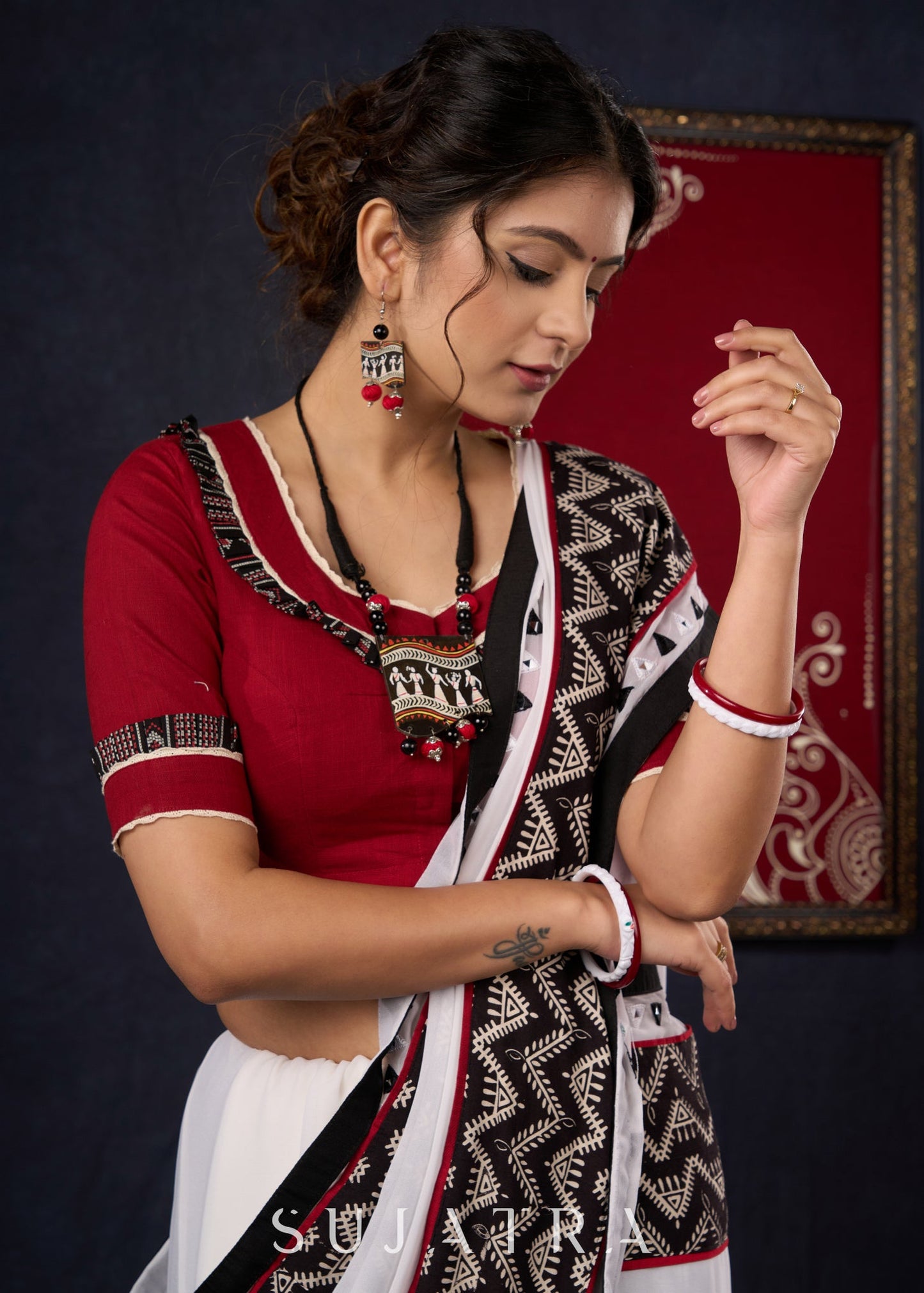 Exclusive Georgette saree with Ajrakh borders & Intricate Hand Embroidered highlights