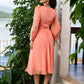 Graceful peach organza dress highlighted with pearl work