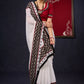 Exclusive Georgette saree with Ajrakh borders & Intricate Hand Embroidered highlights