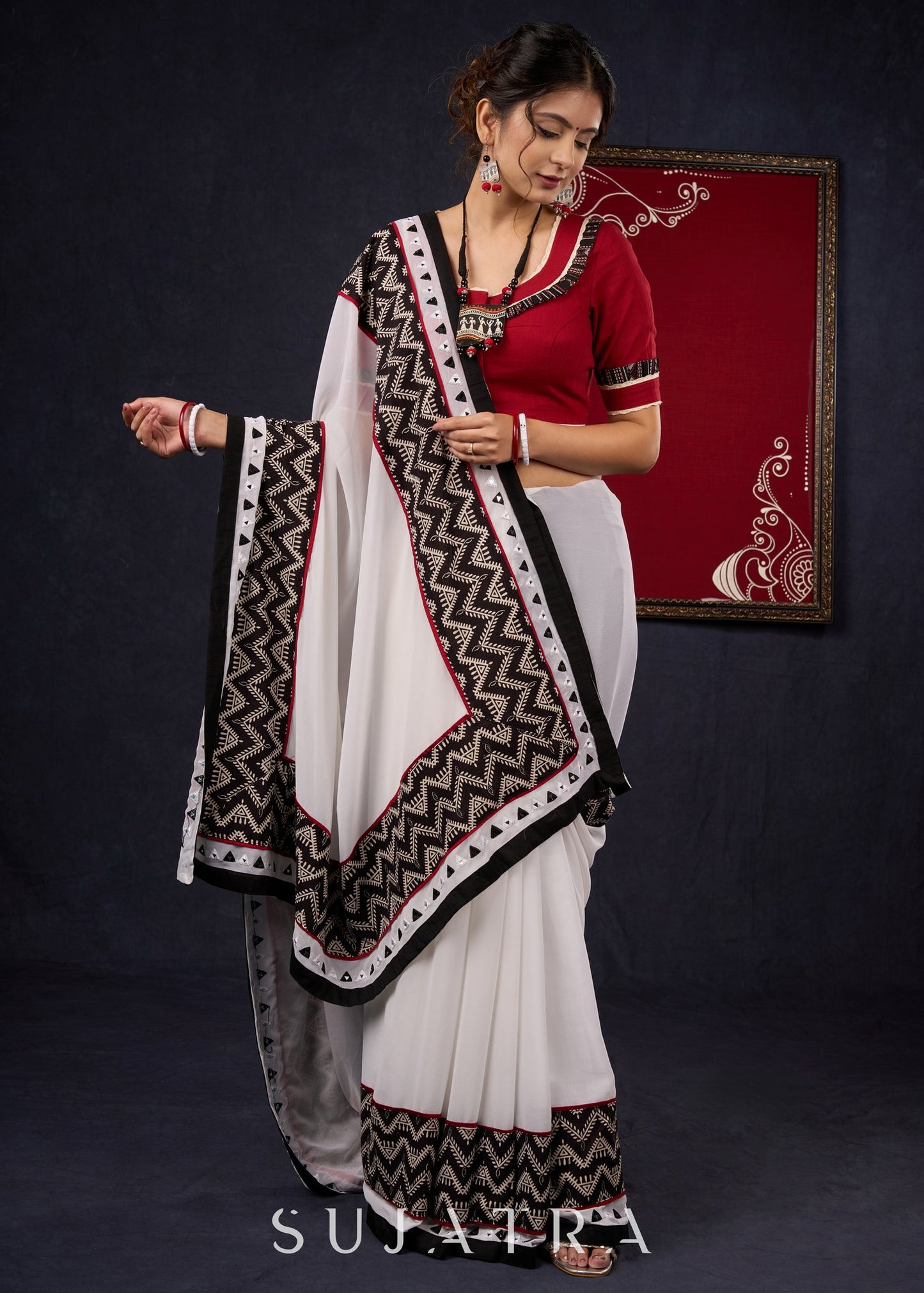 Exclusive Georgette saree with Ajrakh borders & Intricate Hand Embroidered highlights