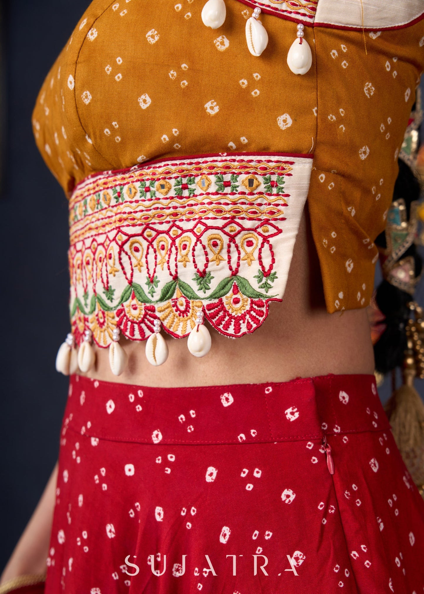 Beautiful Red Bandhani Lehenga With Mustard Embroidered Blouse & Matching Dupatta.