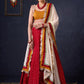 Beautiful Red Bandhani Lehenga With Mustard Embroidered Blouse & Matching Dupatta.