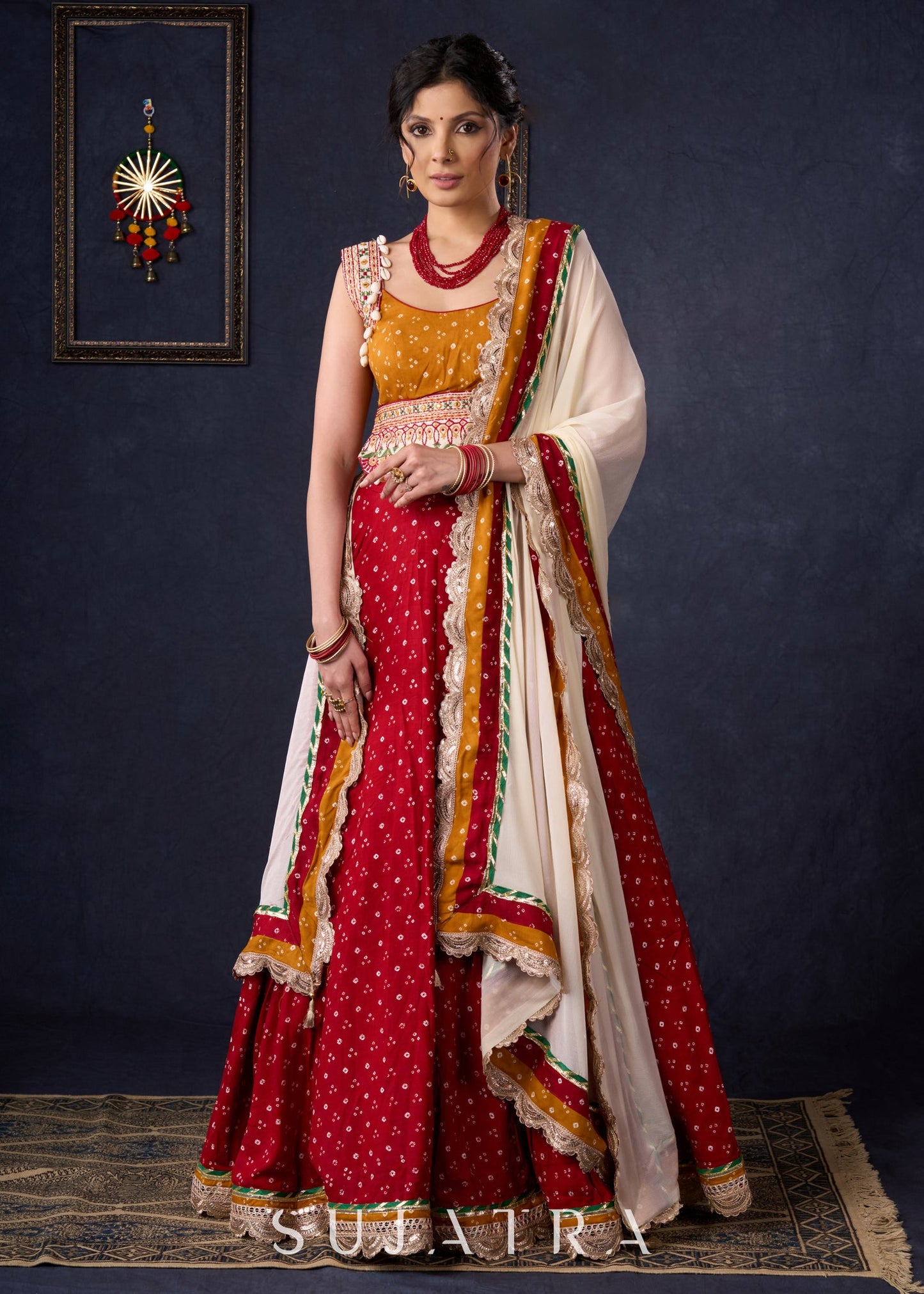 Beautiful Red Bandhani Lehenga With Mustard Embroidered Blouse & Matching Dupatta.