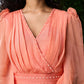 Graceful peach organza dress highlighted with pearl work