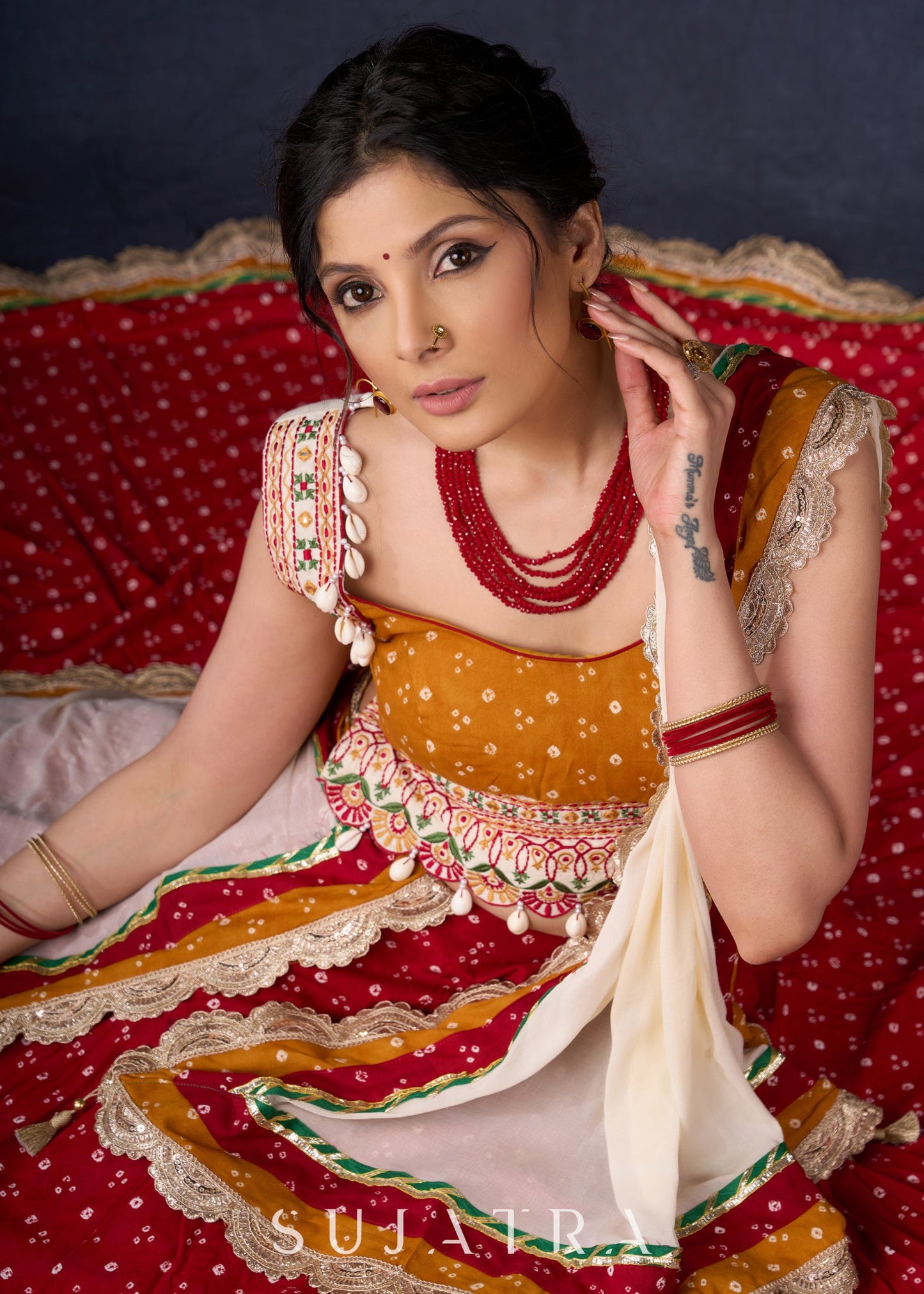 Beautiful Red Bandhani Lehenga With Mustard Embroidered Blouse & Matching Dupatta.