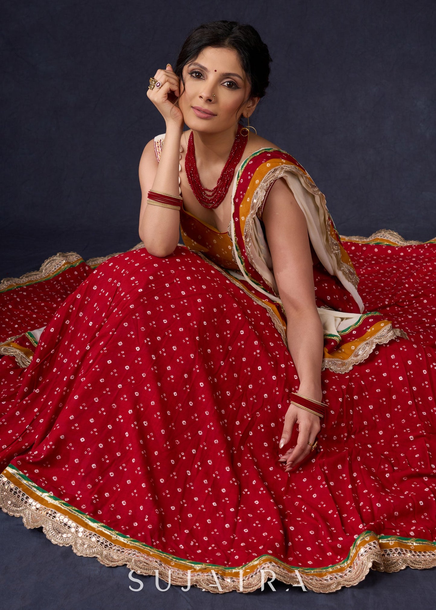 Beautiful Red Bandhani Lehenga With Mustard Embroidered Blouse & Matching Dupatta.