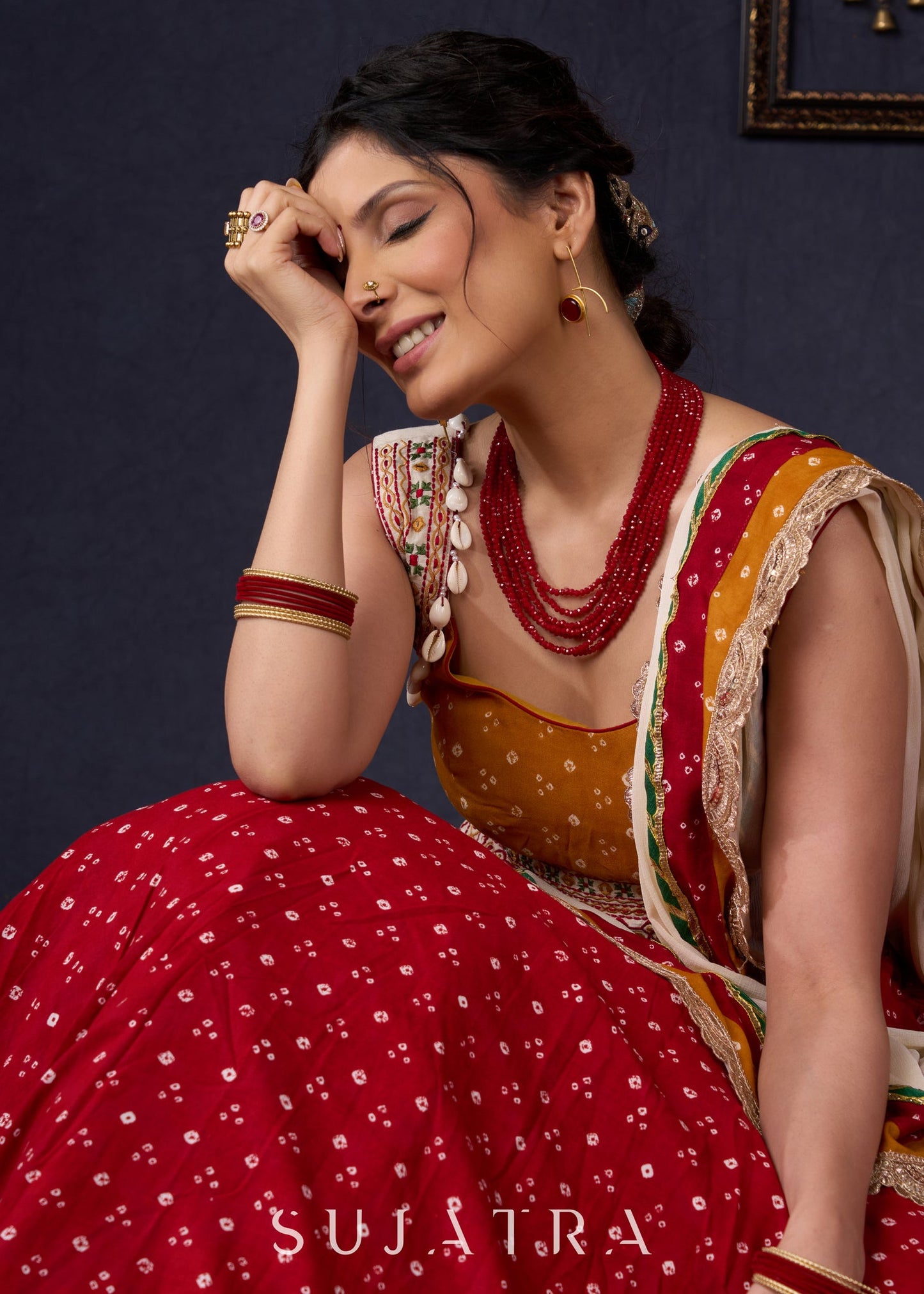 Beautiful Red Bandhani Lehenga With Mustard Embroidered Blouse & Matching Dupatta.