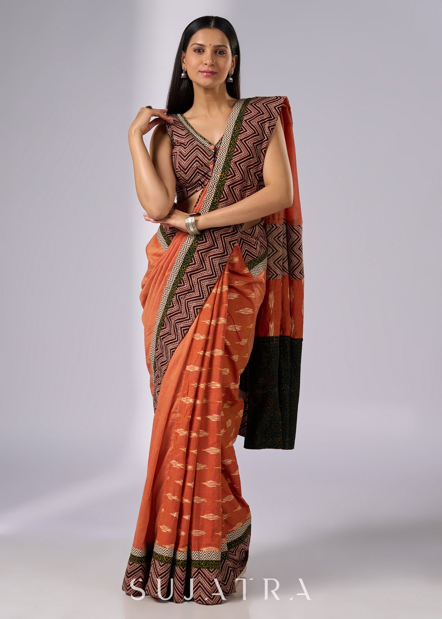 Exclusive orange cotton saree with multi Ajrakh border