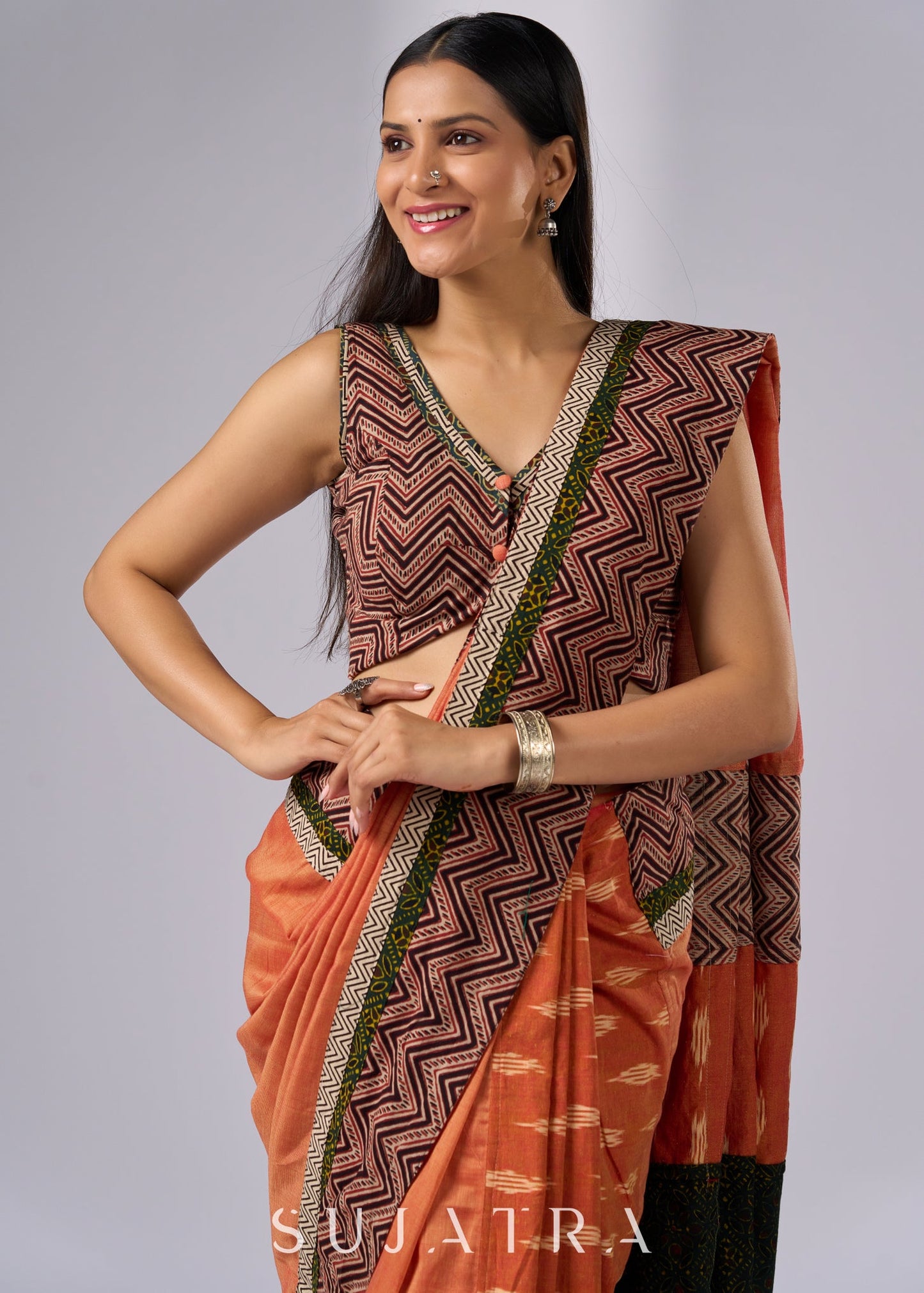 Exclusive orange cotton saree with multi Ajrakh border