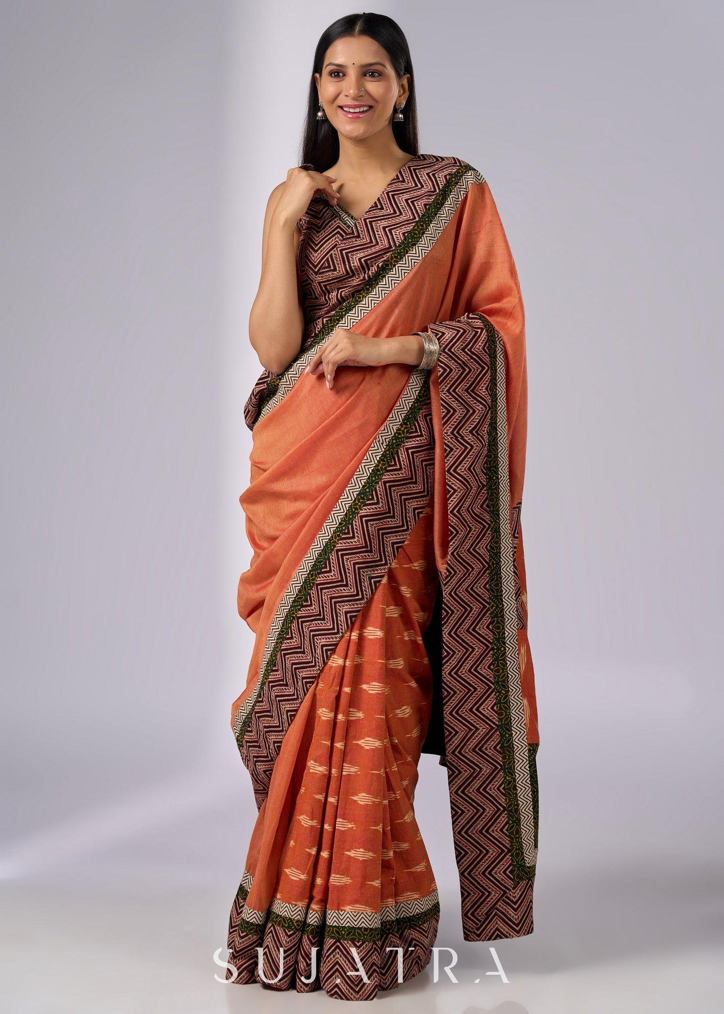 Exclusive orange cotton saree with multi Ajrakh border