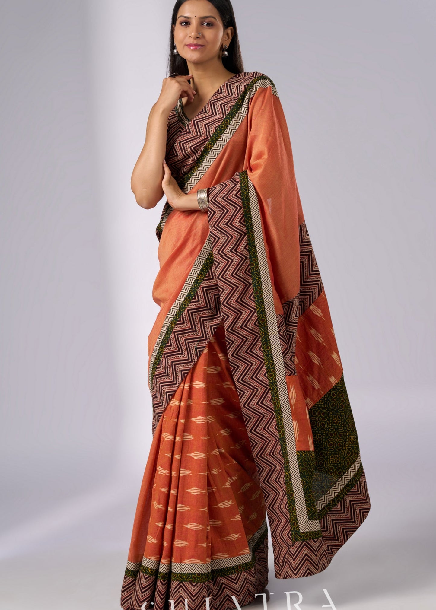 Exclusive orange cotton saree with multi Ajrakh border