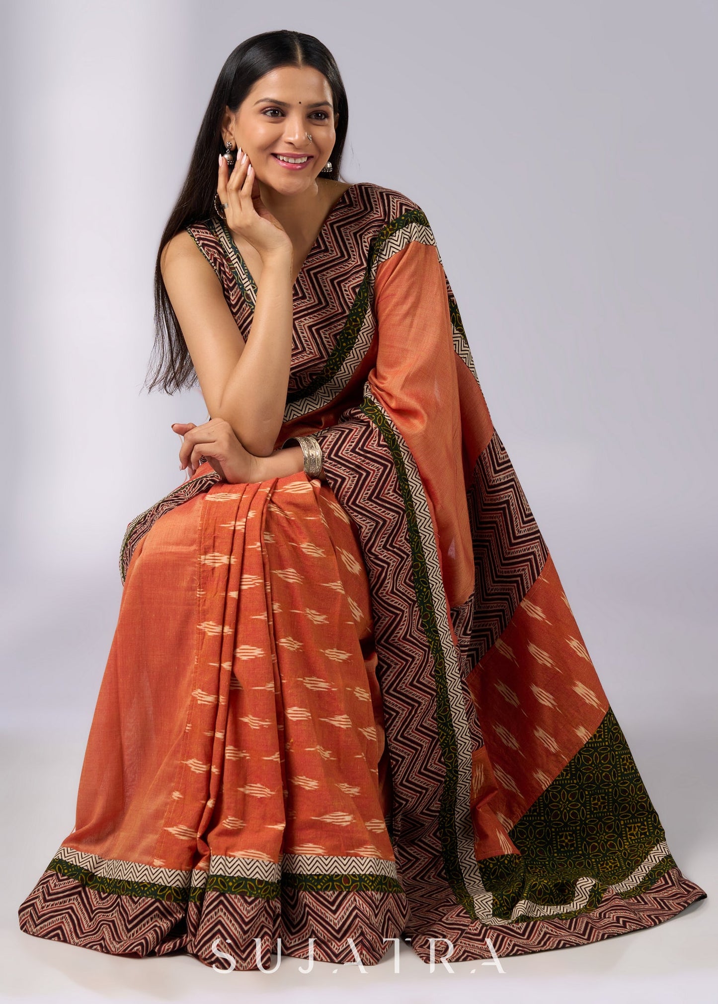 Exclusive orange cotton saree with multi Ajrakh border