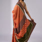 Exclusive orange cotton saree with multi Ajrakh border