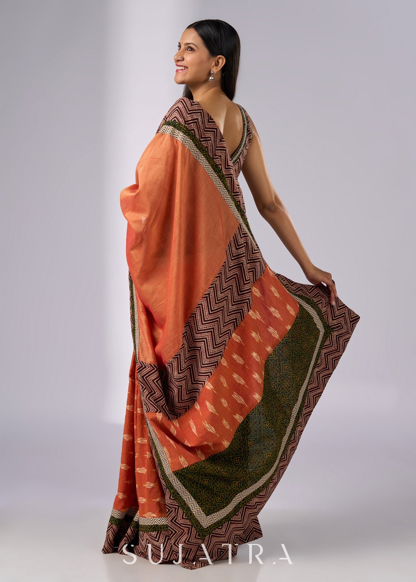 Exclusive orange cotton saree with multi Ajrakh border