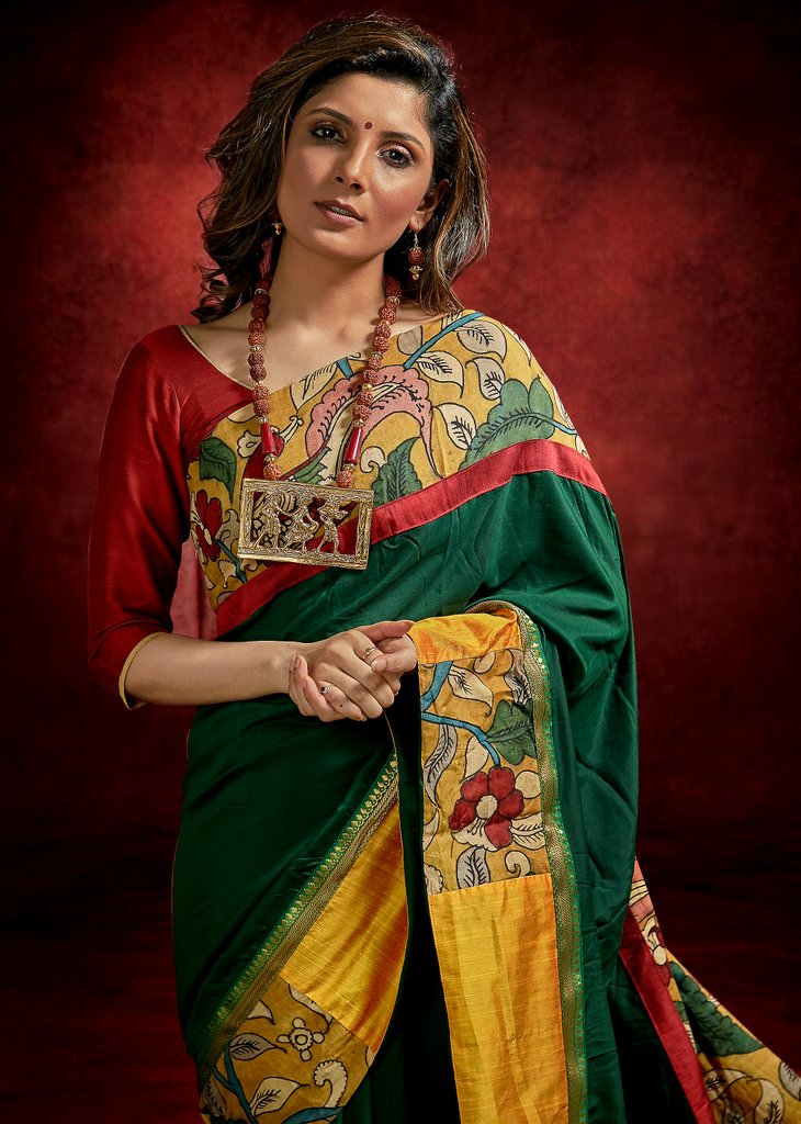 Green crepe satin saree with hand painted kalamakari border