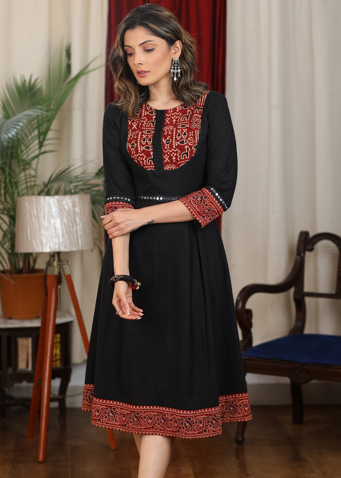 Black cotton flared dress with ajrakh combination highlighted with mirror lace