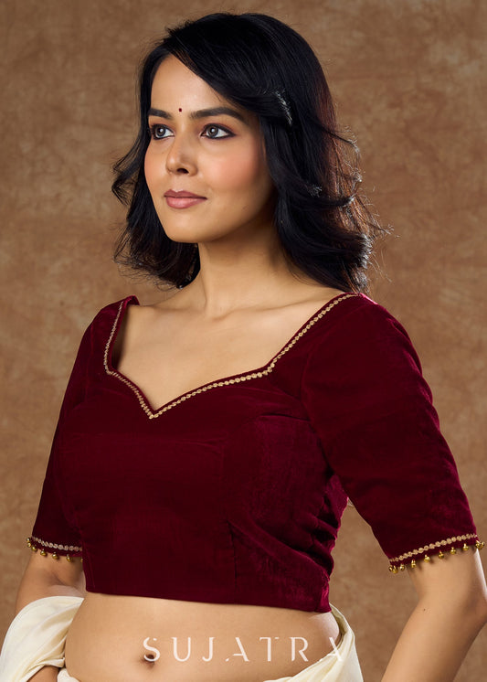 Rich maroon velvet  blouse with subtle embroidery & gold detailing on sleeves