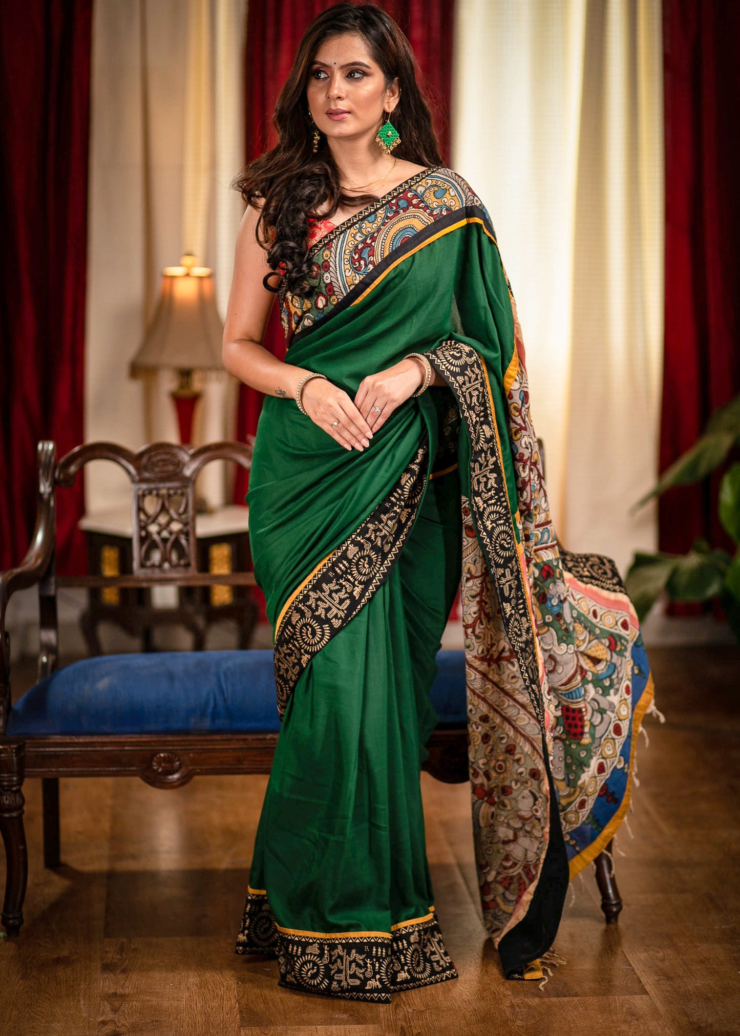 Forest green satin saree with hand painted kalamkari pallu