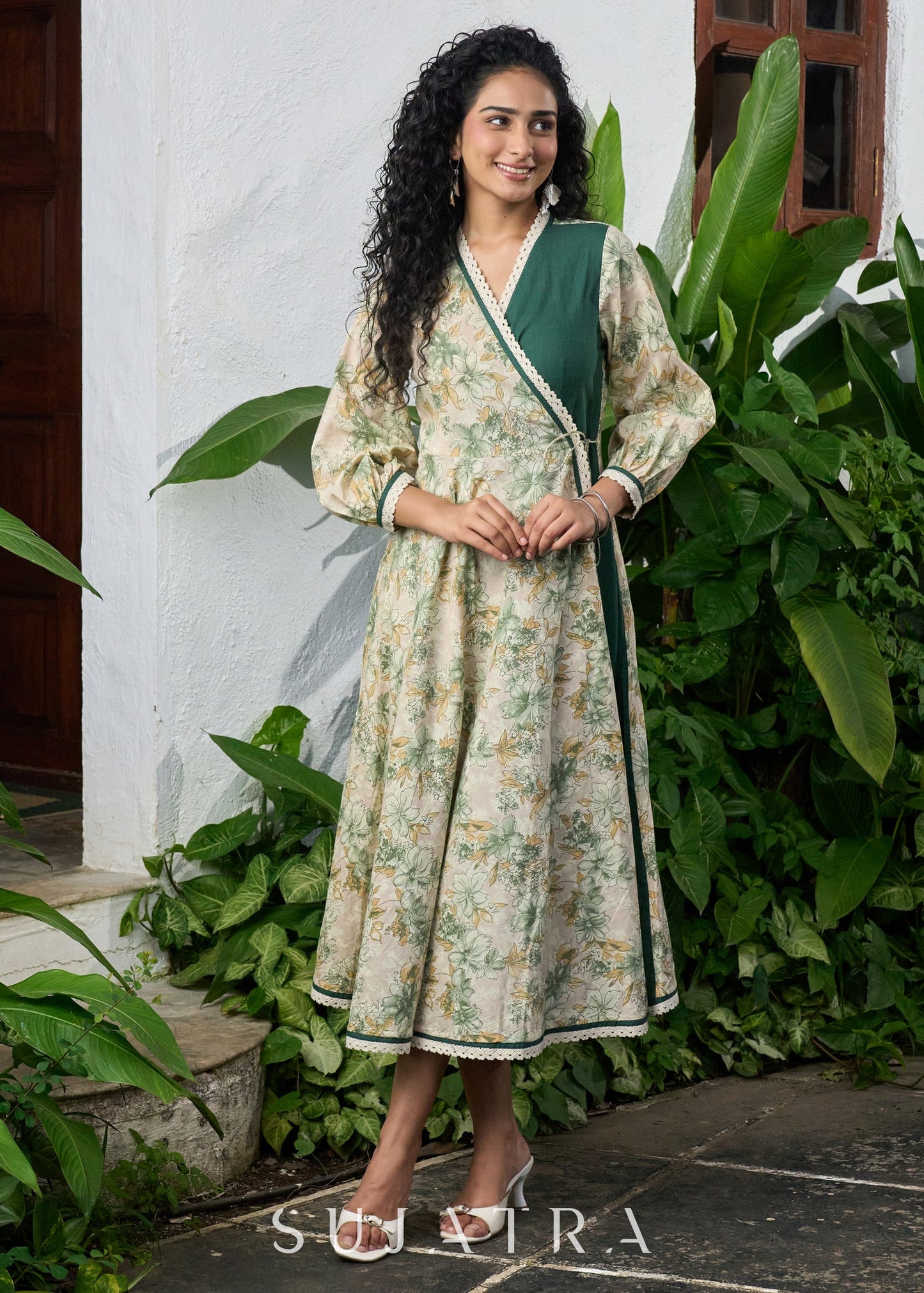 Graceful bottle green printed cotton overlap dress highlighted with macrame lace