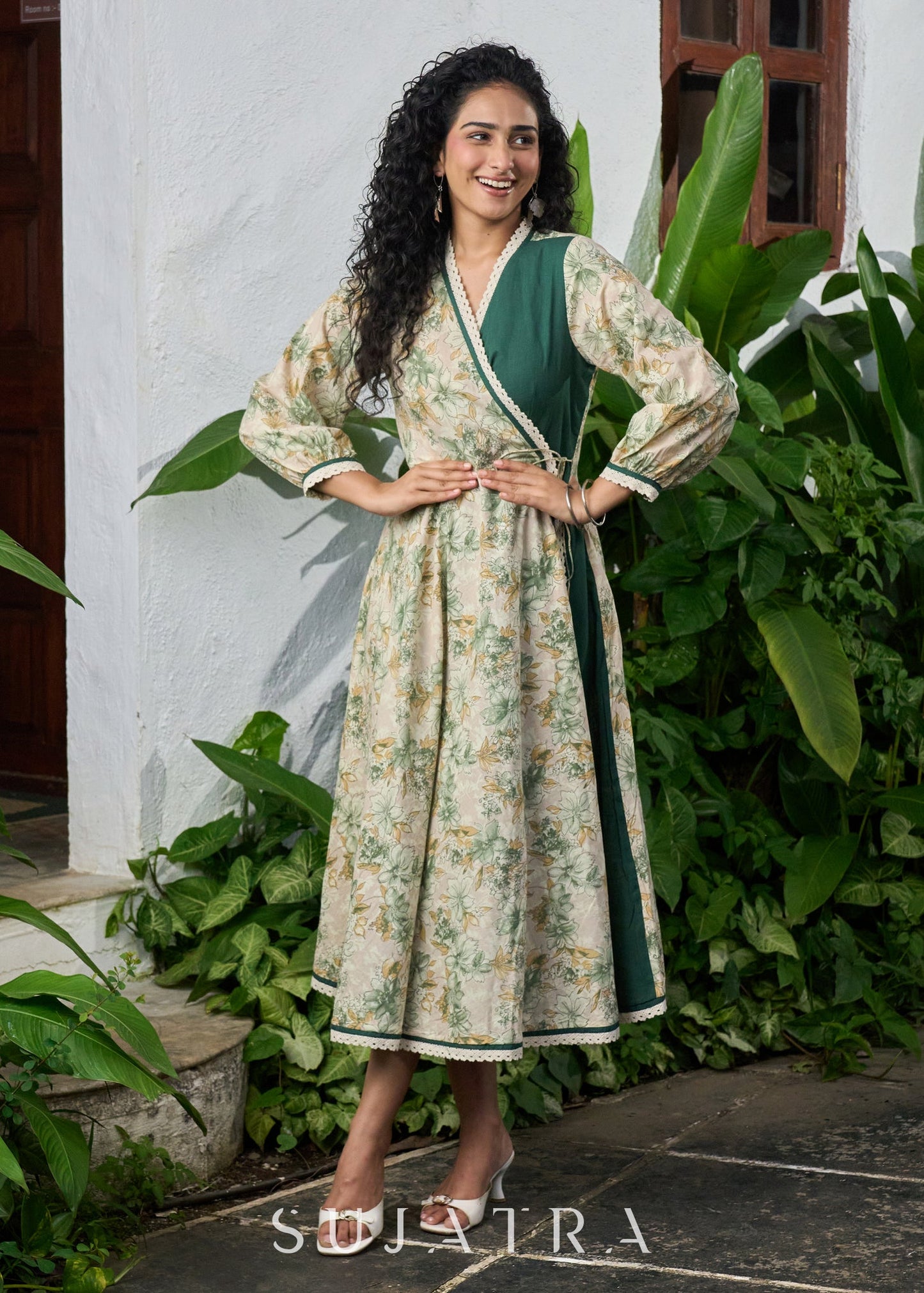 Graceful bottle green printed cotton overlap dress highlighted with macrame lace