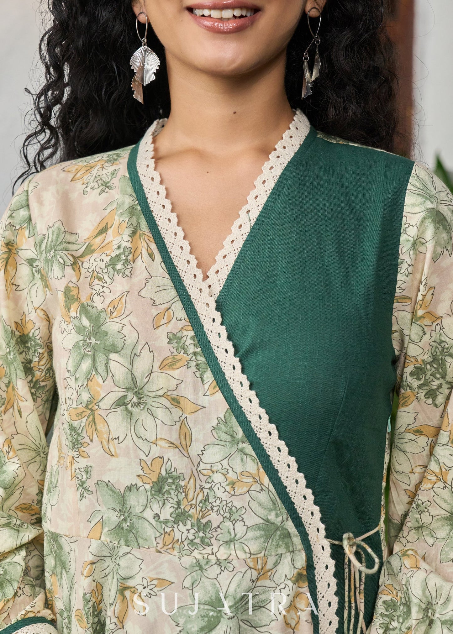 Graceful bottle green printed cotton overlap dress highlighted with macrame lace