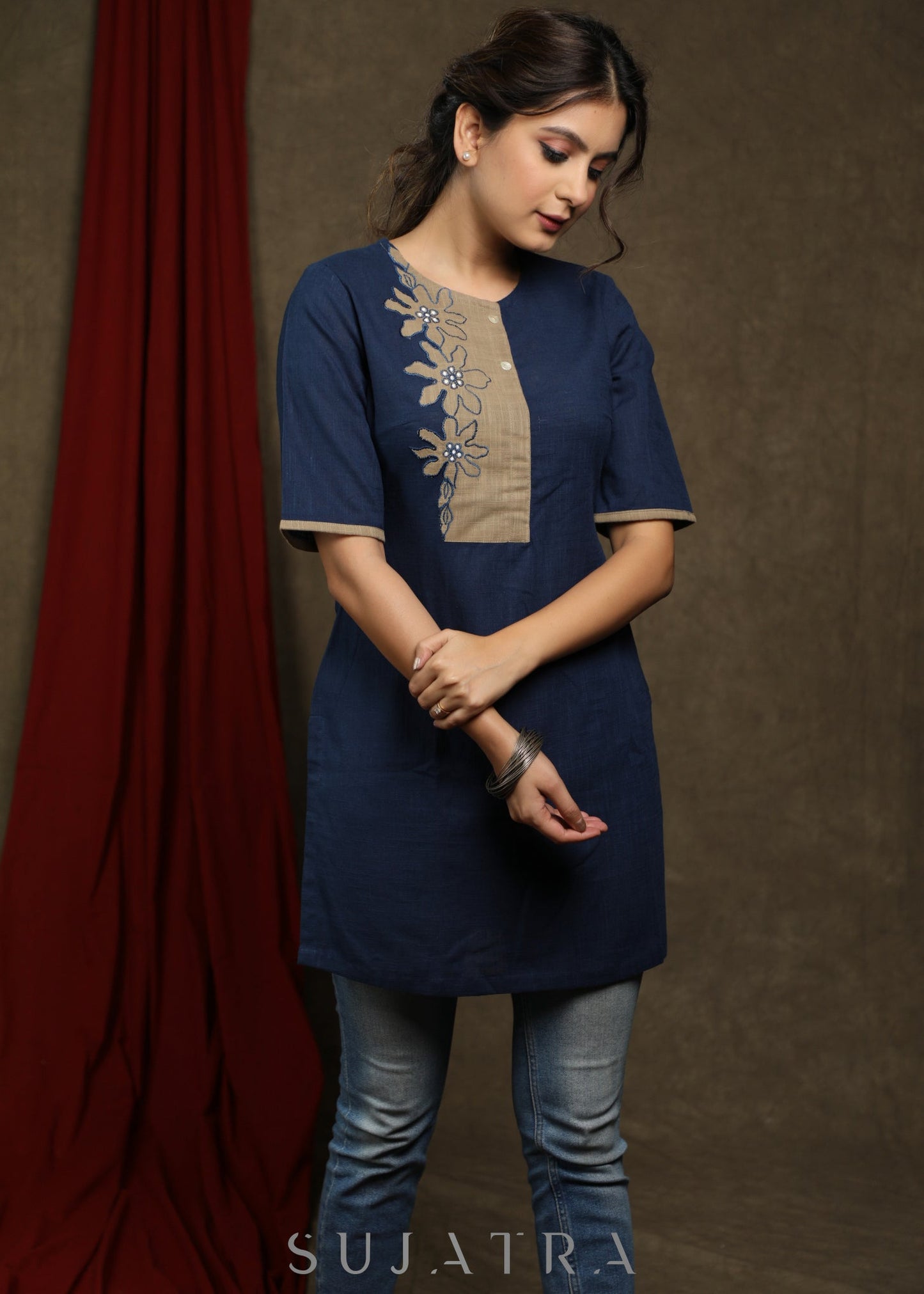 Navy blue cotton tunic with beige floral cutwork design.