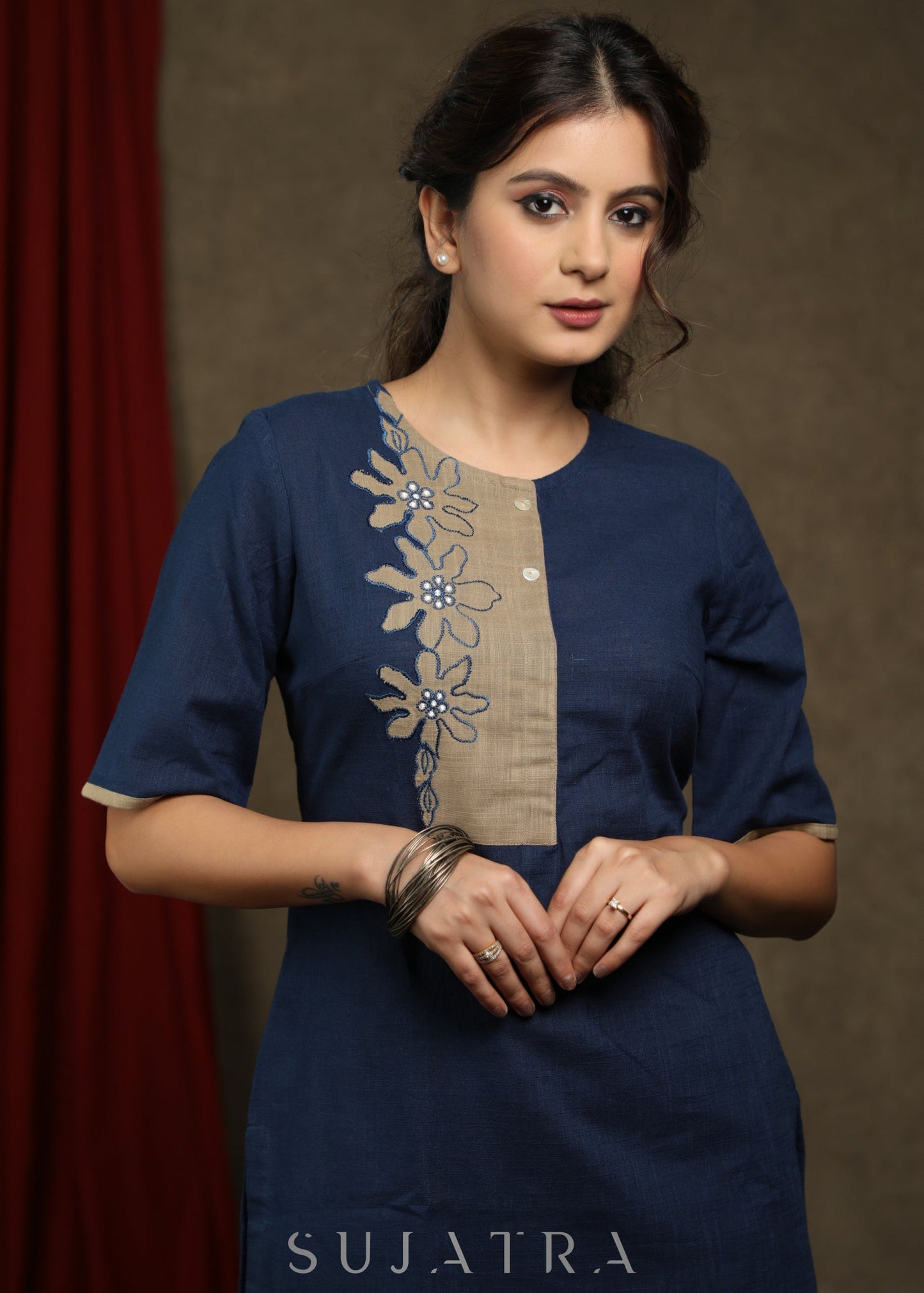 Navy blue cotton tunic with beige floral cutwork design.