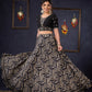 Elegant Black Printed Lehenga With Embroidered Blouse & Net Dupatta.