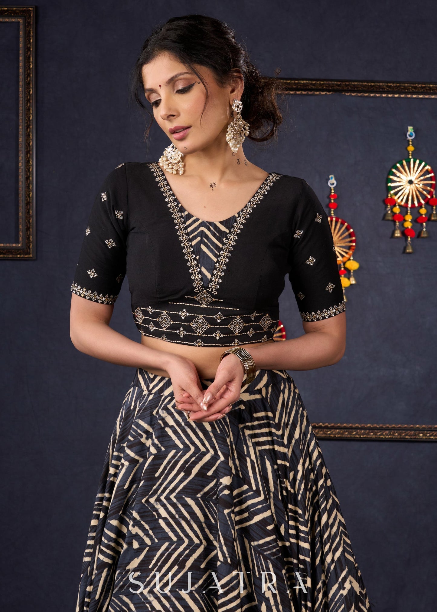 Elegant Black Printed Lehenga With Embroidered Blouse & Net Dupatta.