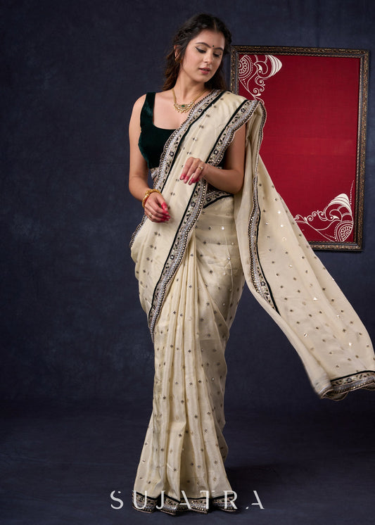 Classy Tissue saree with all-over work Highlighted with Beautiful border