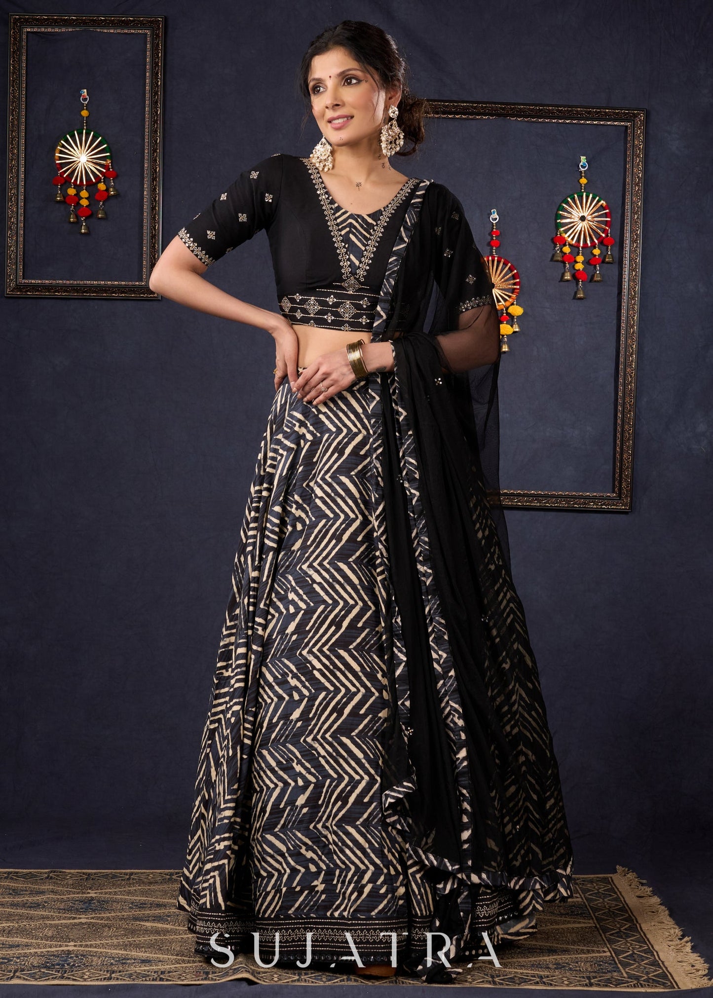 Elegant Black Printed Lehenga With Embroidered Blouse & Net Dupatta.