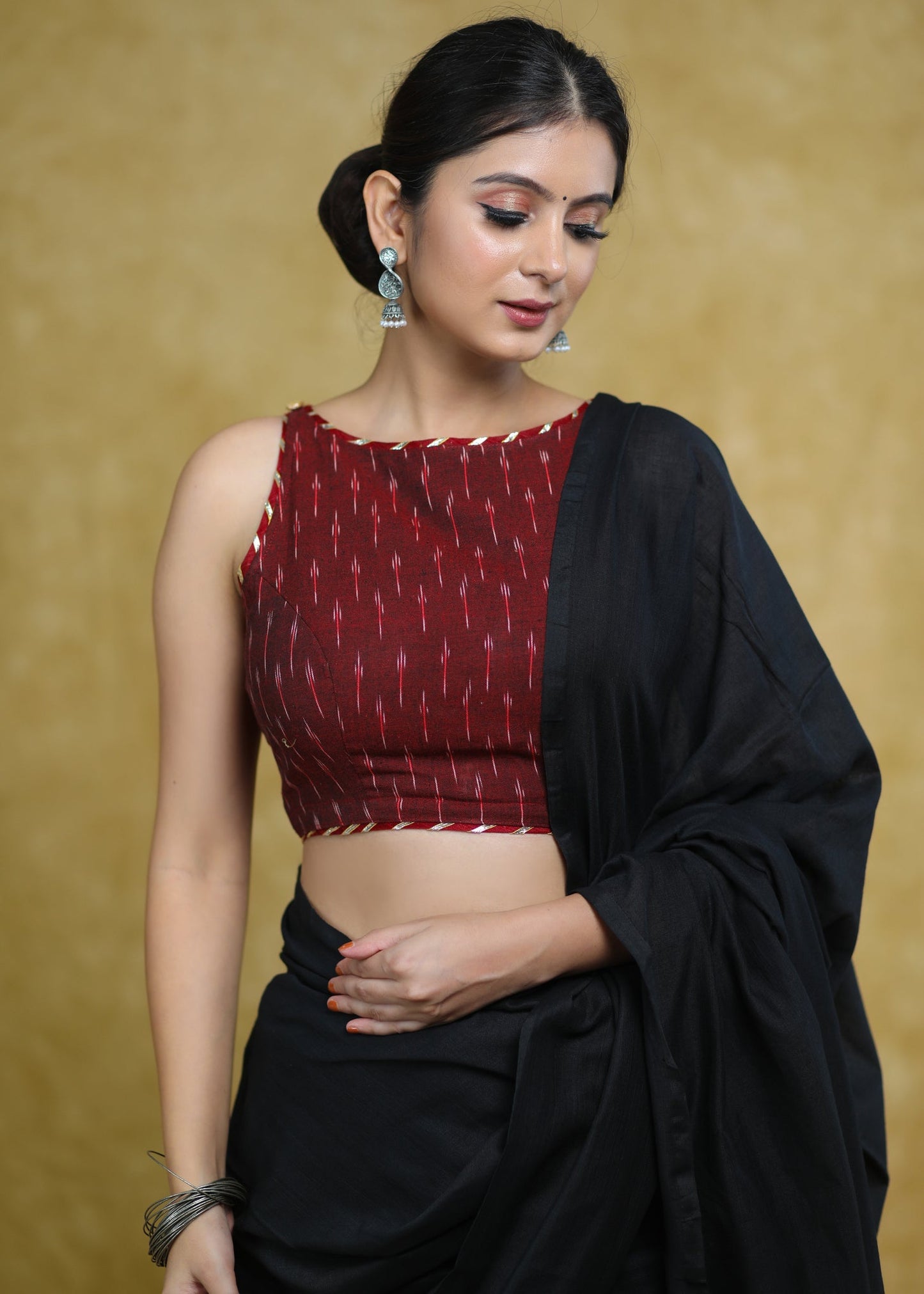 Elegant Maroon Ikaat Sleeveless Blouse with Golden Gota-Patti Detailing & Smart Back