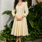 Subtle light yellow cotton dress highlighted with beautiful embroidered lace