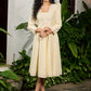 Subtle light yellow cotton dress highlighted with beautiful embroidered lace