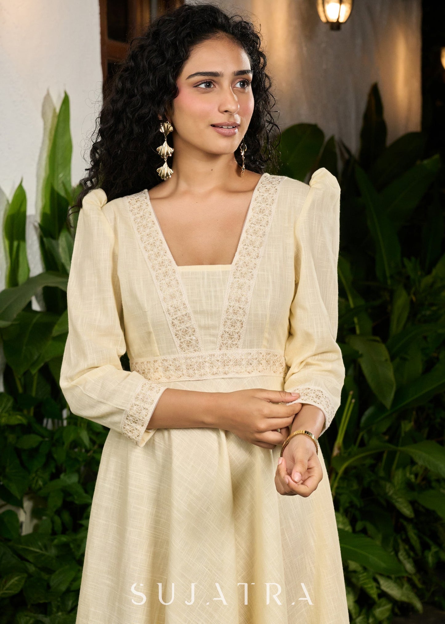 Subtle light yellow cotton dress highlighted with beautiful embroidered lace