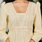 Subtle light yellow cotton dress highlighted with beautiful embroidered lace