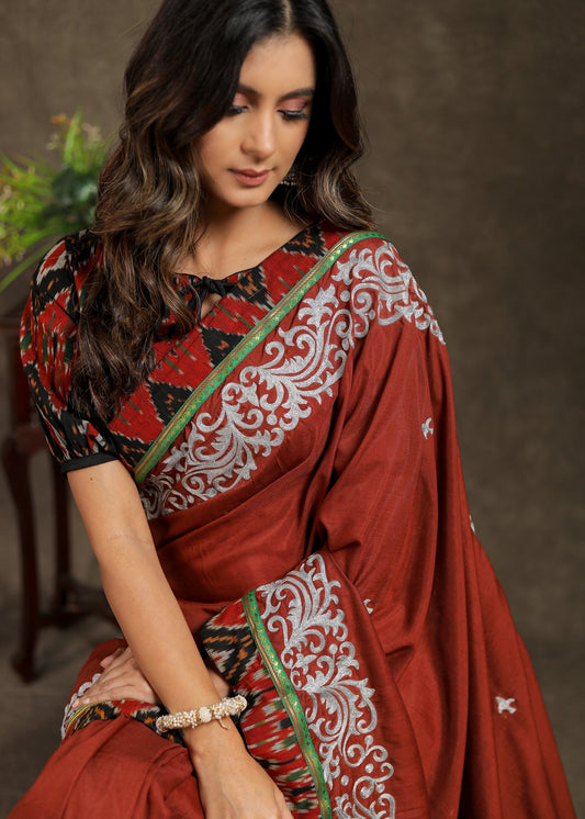 Brown Rayon saree with delicate embroidery and Ajrakh border