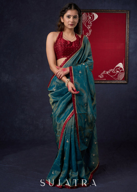 Exclusive Tissue saree with Golden Butta Work All-over Highlighted with Maroon Detailing