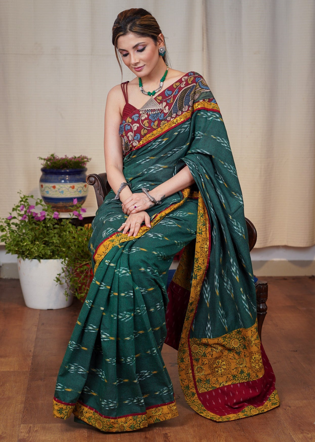 Elegant green Ikaat cotton saree with exclusive hand painted Kalamkari border