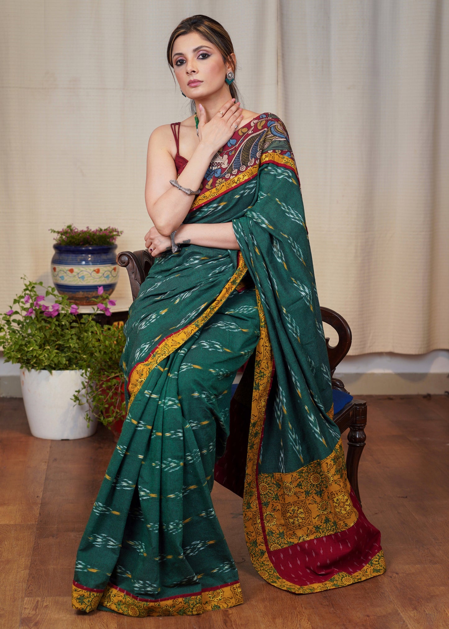 Elegant green Ikaat cotton saree with exclusive hand painted Kalamkari border