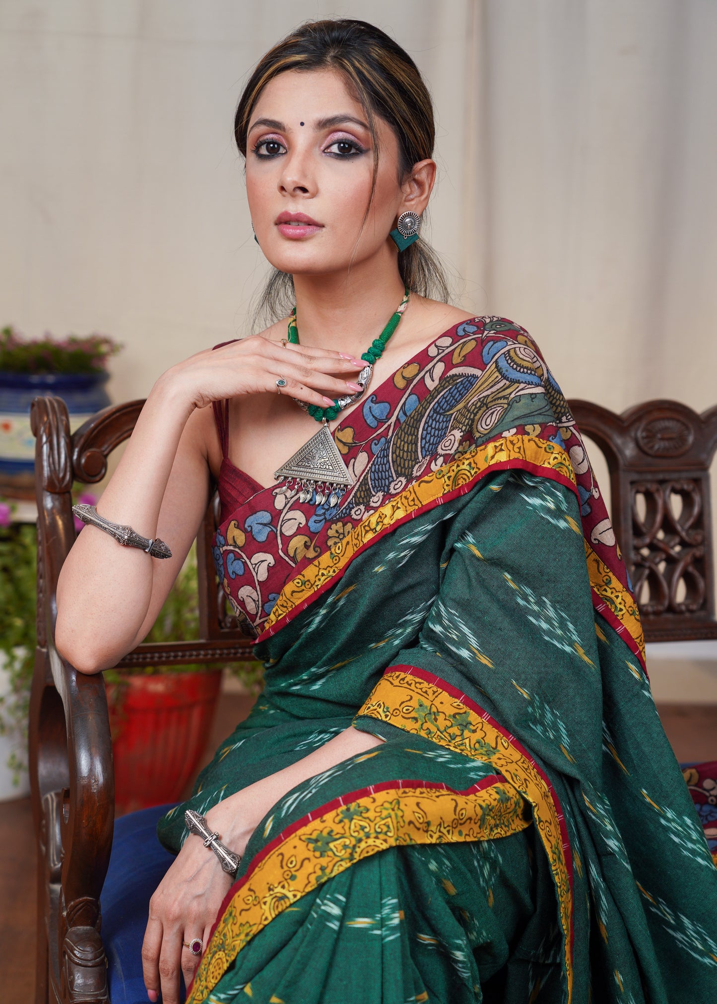 Elegant green Ikaat cotton saree with exclusive hand painted Kalamkari border