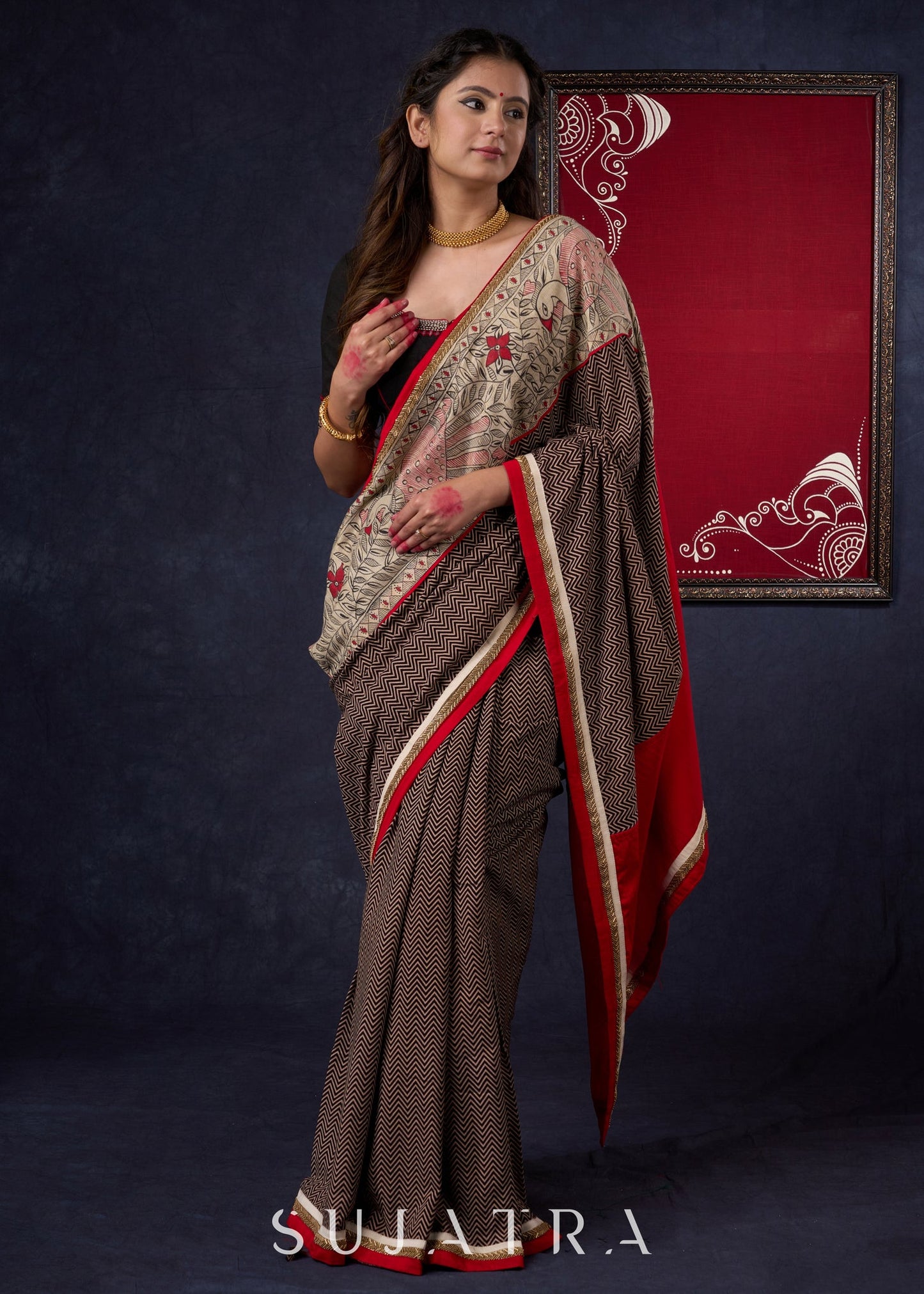 Exclusive Black Ajrakh Cotton Saree with Hand-Painted Madhubani Border Highlighted with Maroon Detailing