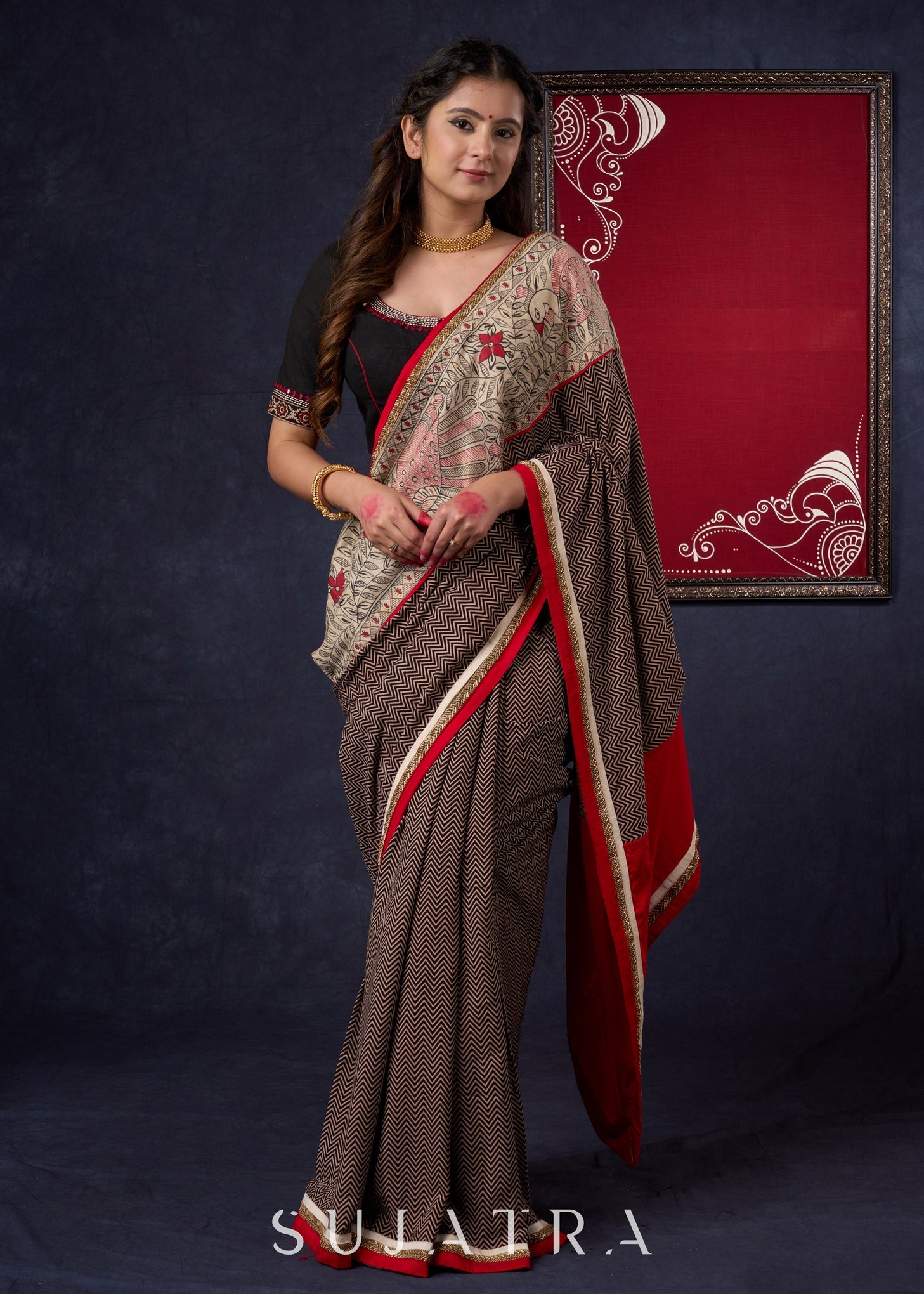 Exclusive Black Ajrakh Cotton Saree with Hand-Painted Madhubani Border Highlighted with Maroon Detailing