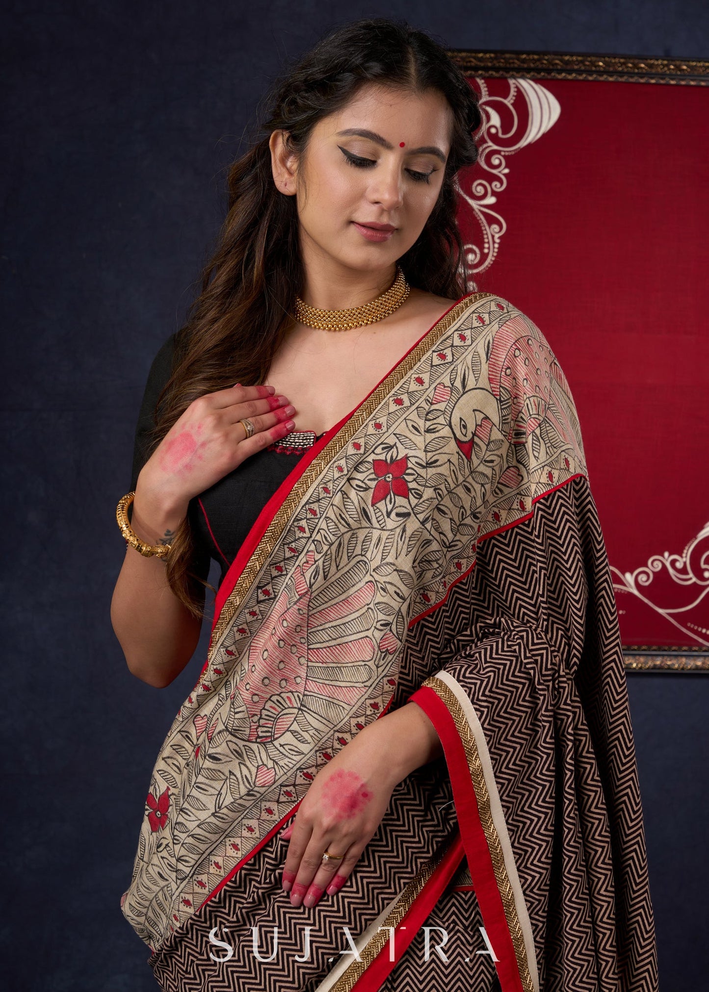 Exclusive Black Ajrakh Cotton Saree with Hand-Painted Madhubani Border Highlighted with Maroon Detailing