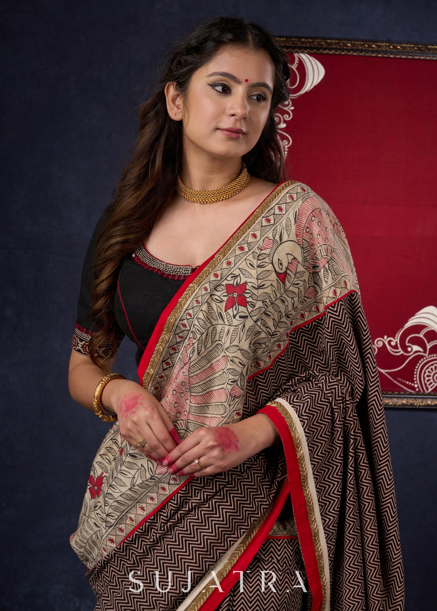 Exclusive Black Ajrakh Cotton Saree with Hand-Painted Madhubani Border Highlighted with Maroon Detailing