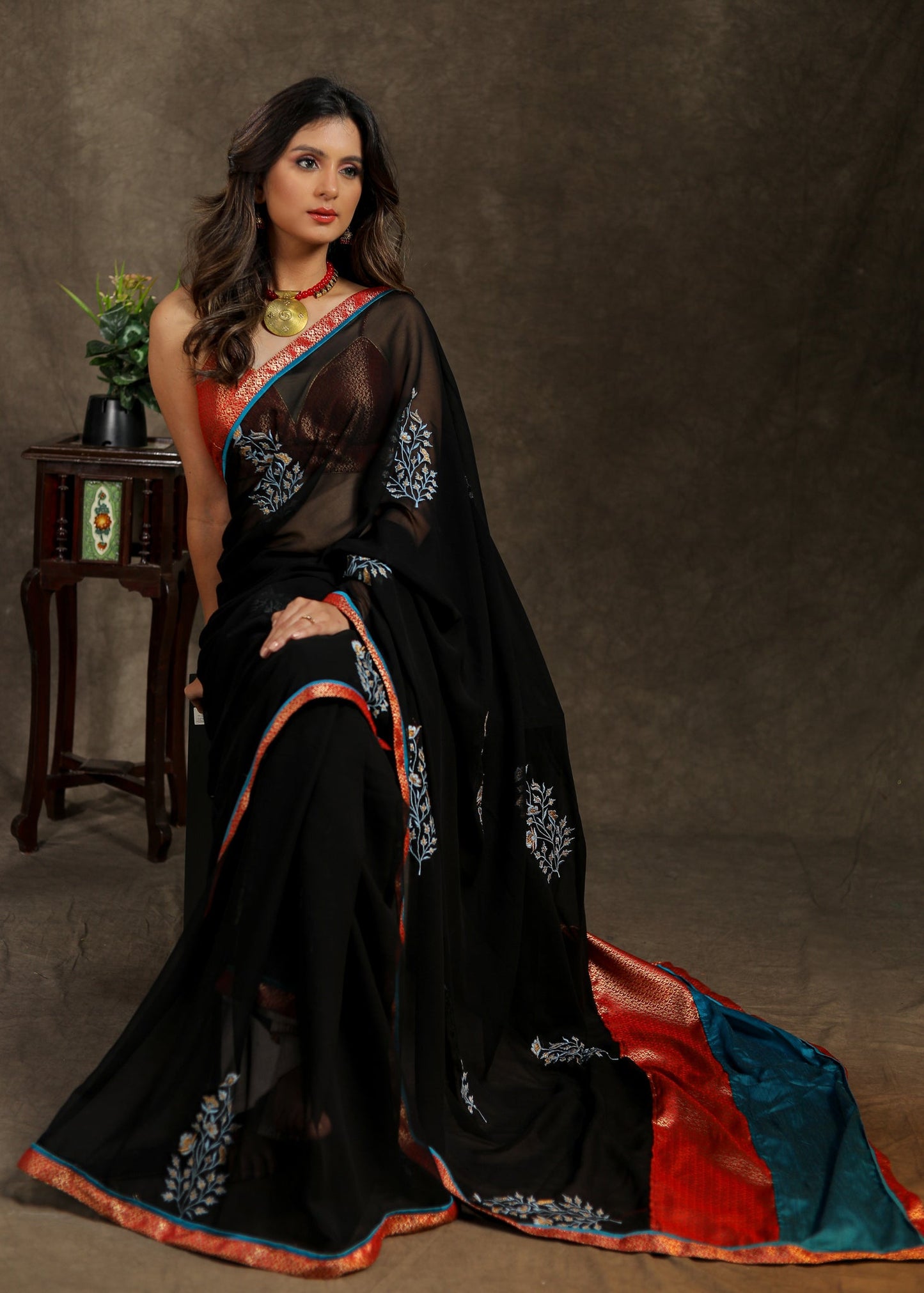 Classy black Georgette saree with embroidery motif and Banarasi pallu