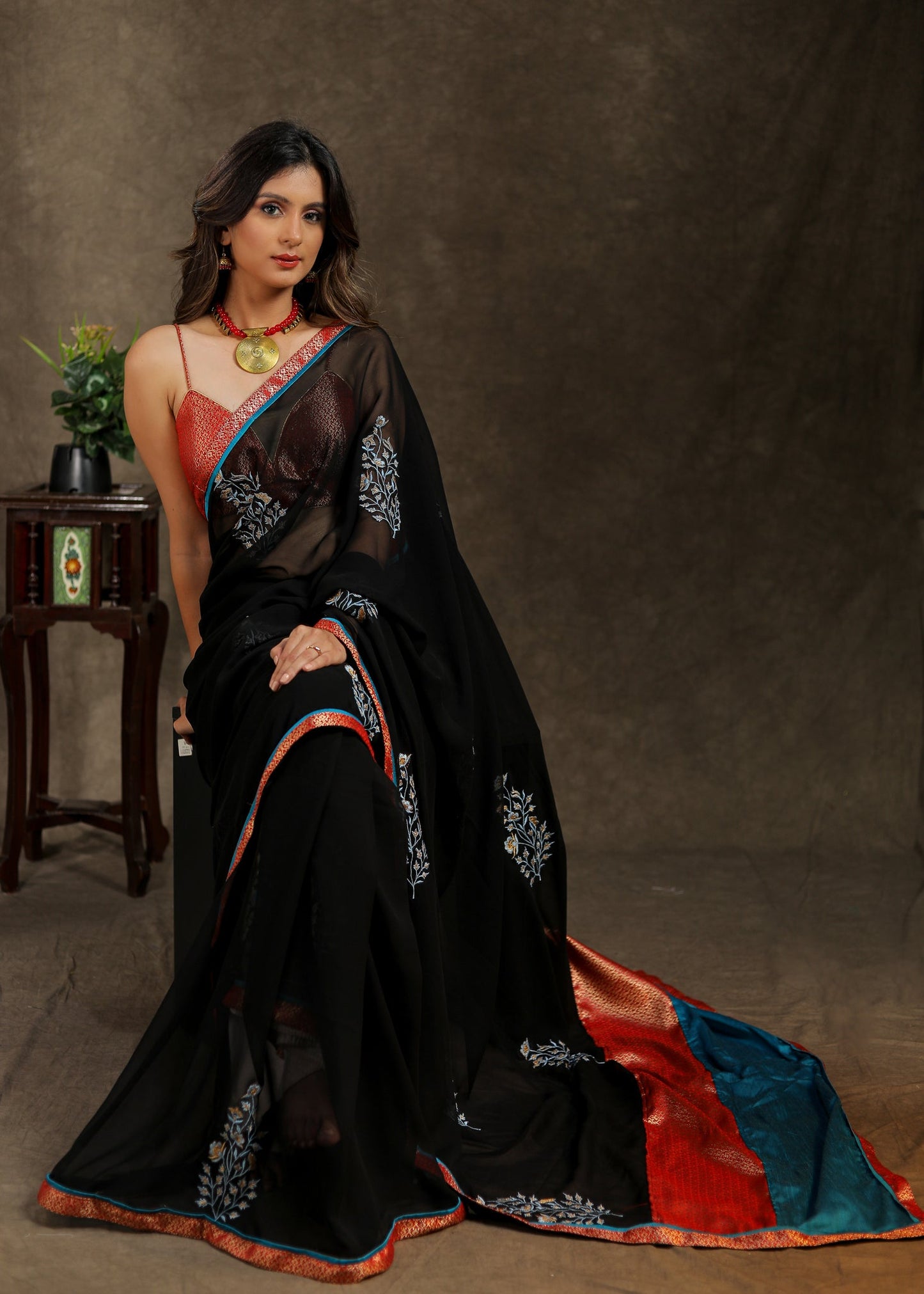 Classy black Georgette saree with embroidery motif and Banarasi pallu