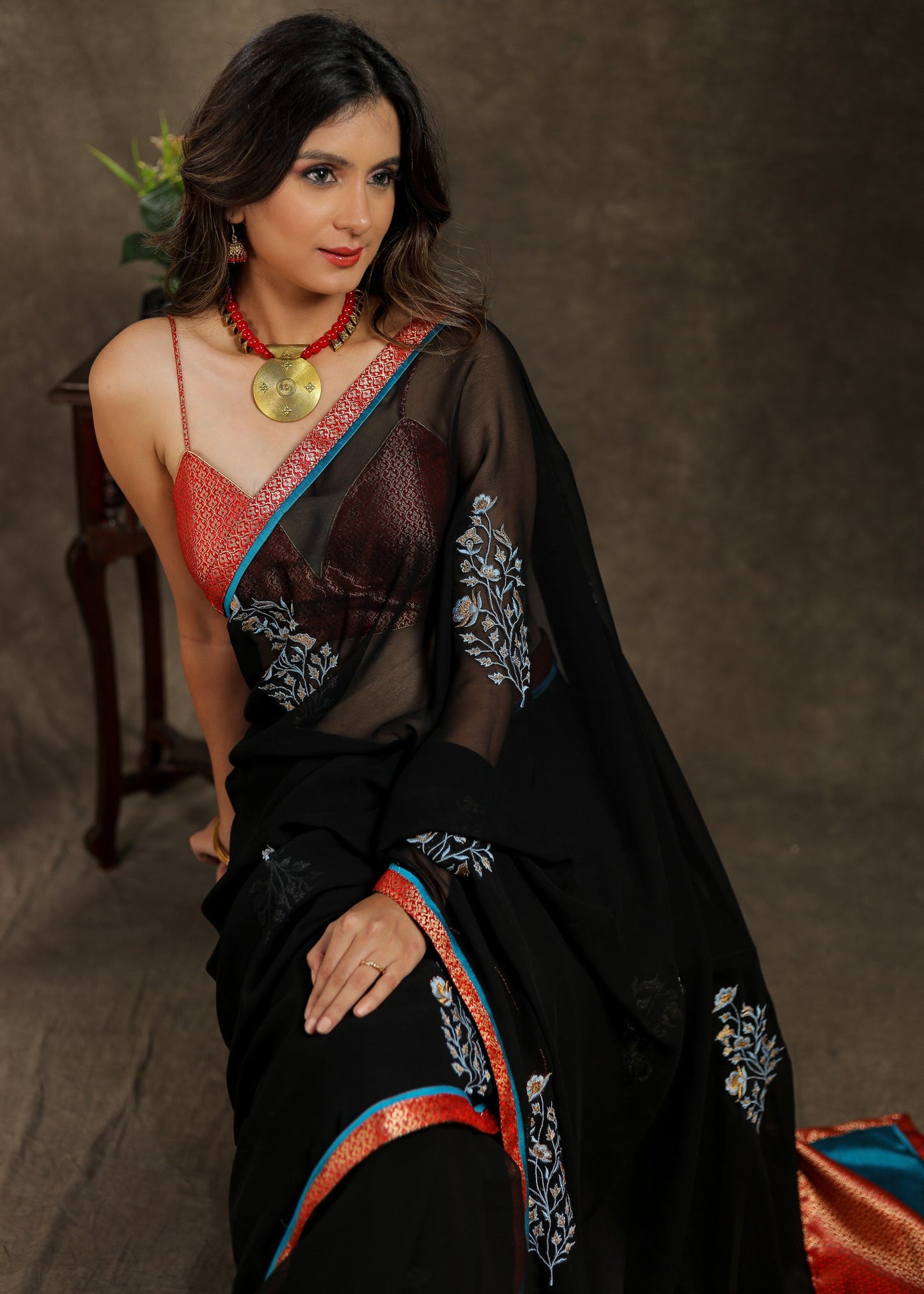 Classy black Georgette saree with embroidery motif and Banarasi pallu