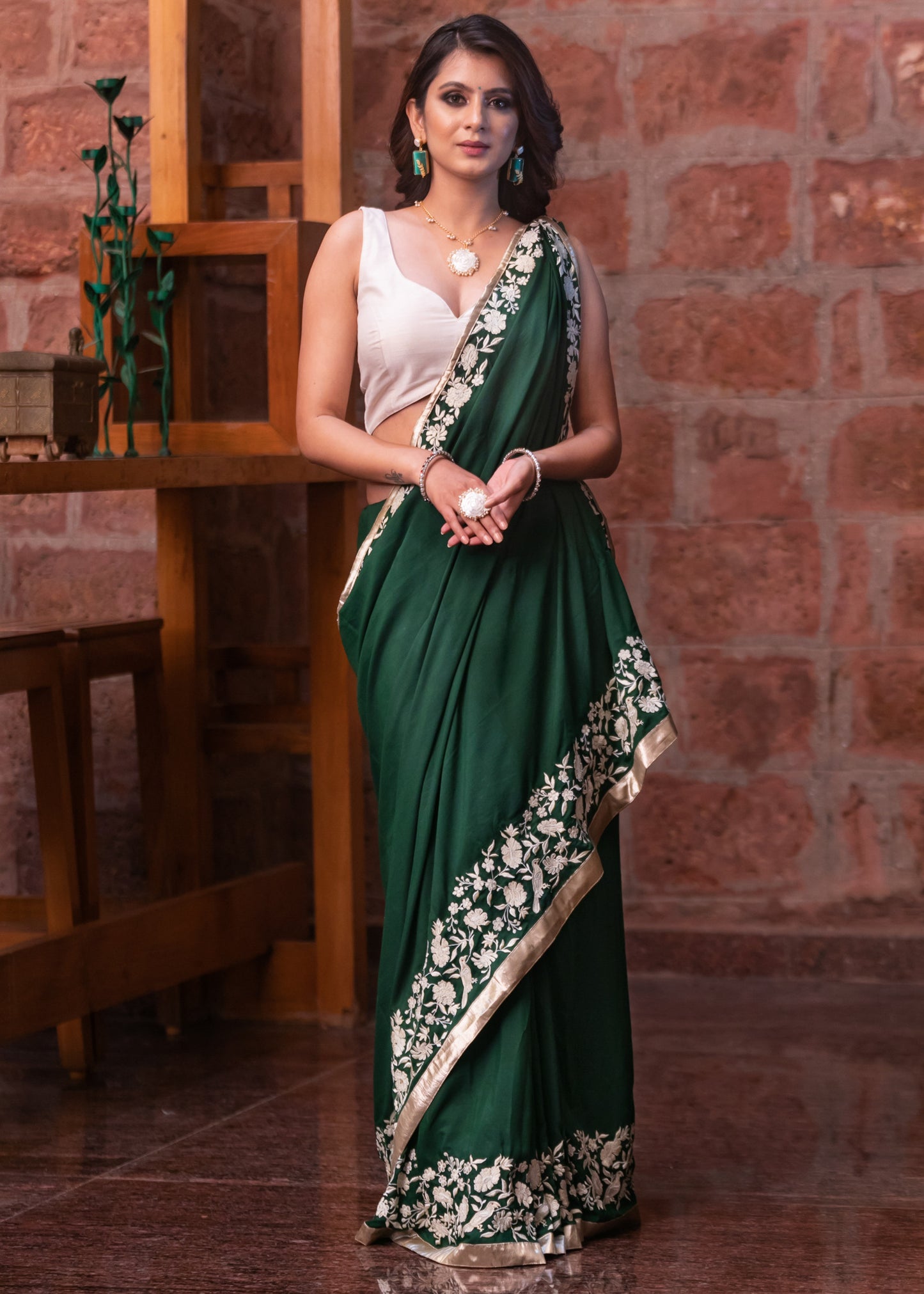 Forest green satin saree with parsi embroidered border