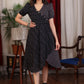 Elegant black ikat and katha work overlap dress highlighted with beautiful wooden buttons